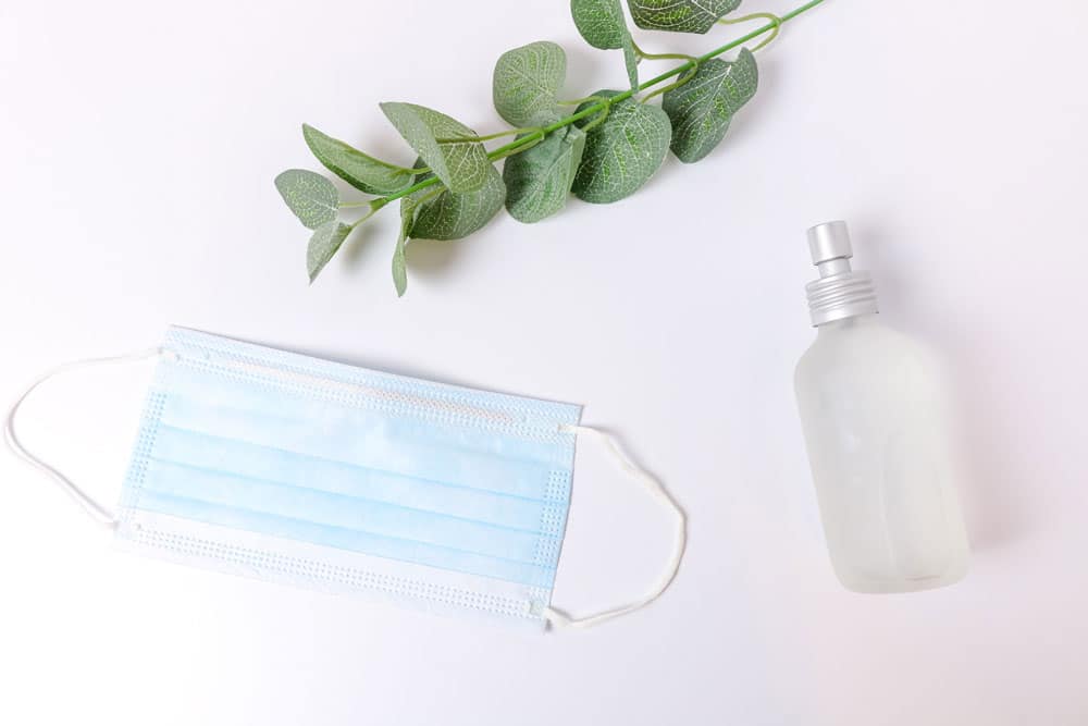 Blue surgical mask and hand sanitizer